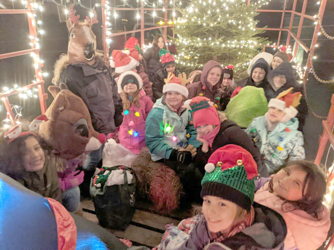 Children enjoy a hayride at the James Dworsky Holiday Parade,. Held annually the Friday after Thanksgiving in Jeffersonville, it is sponsored by JEMS and draws people from all over Sullivan County.